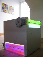 Siegfried Kreitner, Bodenarbeit III, 2008, Aluminium . farbiges Plexiglas . Neonsystem Blauentladung, 3 E-Motore 4 U/min, 3 Malteserkreuzgetriebe, 42-45 cm x 42-44 cm x 45 cm